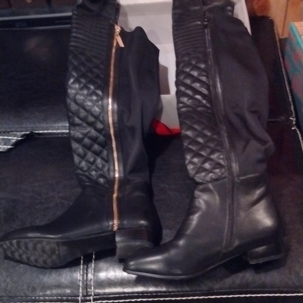 Black leather quilted over the knee boots